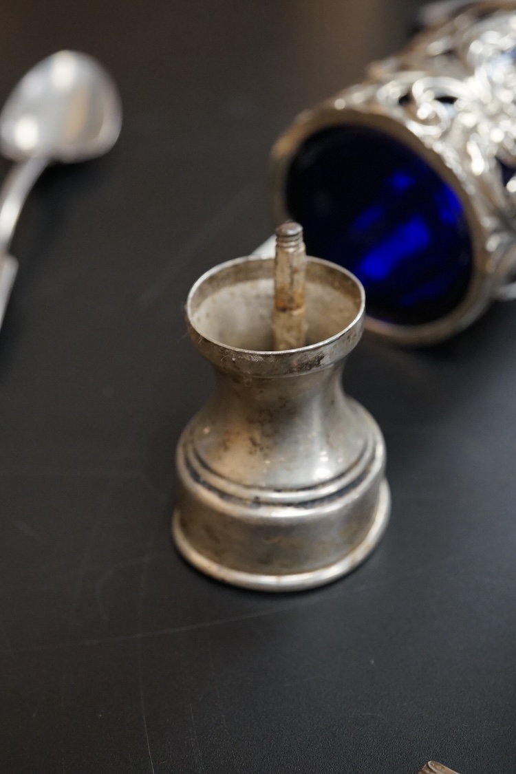A small group of collectable silver including a pair of modern 925 and lapis lazuli set cocktail stirring spoons, an Edwardian small hexagonal tea caddy, a late Victorian pierced silver salt with blue glass liner and eig